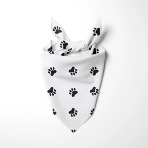 White dog bandana with black paw print pattern, tied at the top