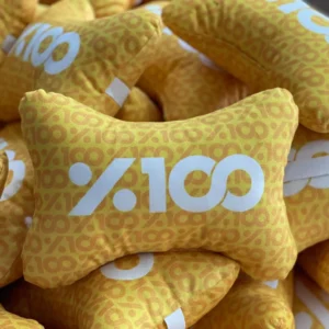 Custom yellow bone-shaped neck pillows with white %100 branding – Textile Promos