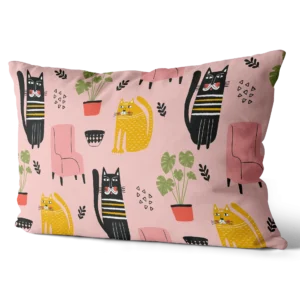 Toddler pillow with pink background featuring cute black and yellow cat illustrations and home decor elements